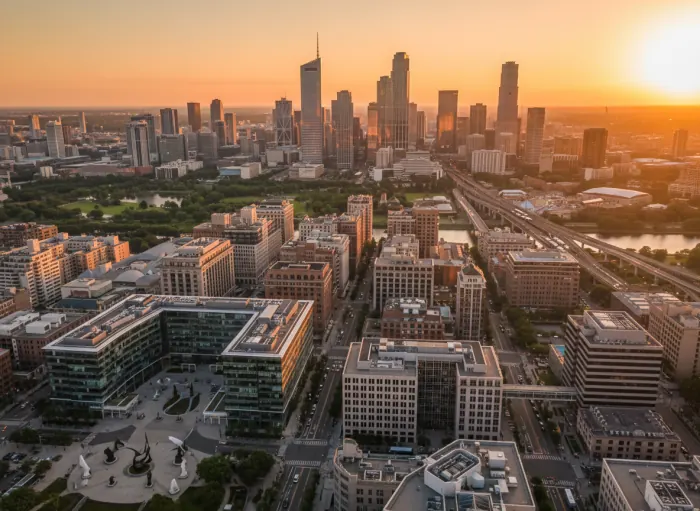 City skyline at sunset representing different industries