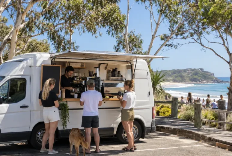 Coffee van serving customers by the beach